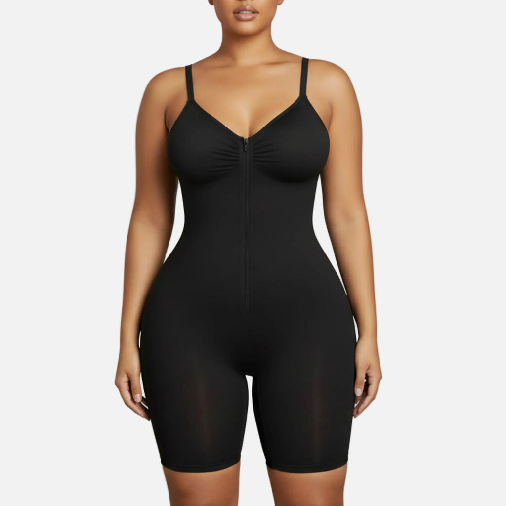 Black bodysuit worn by a model on a plain background