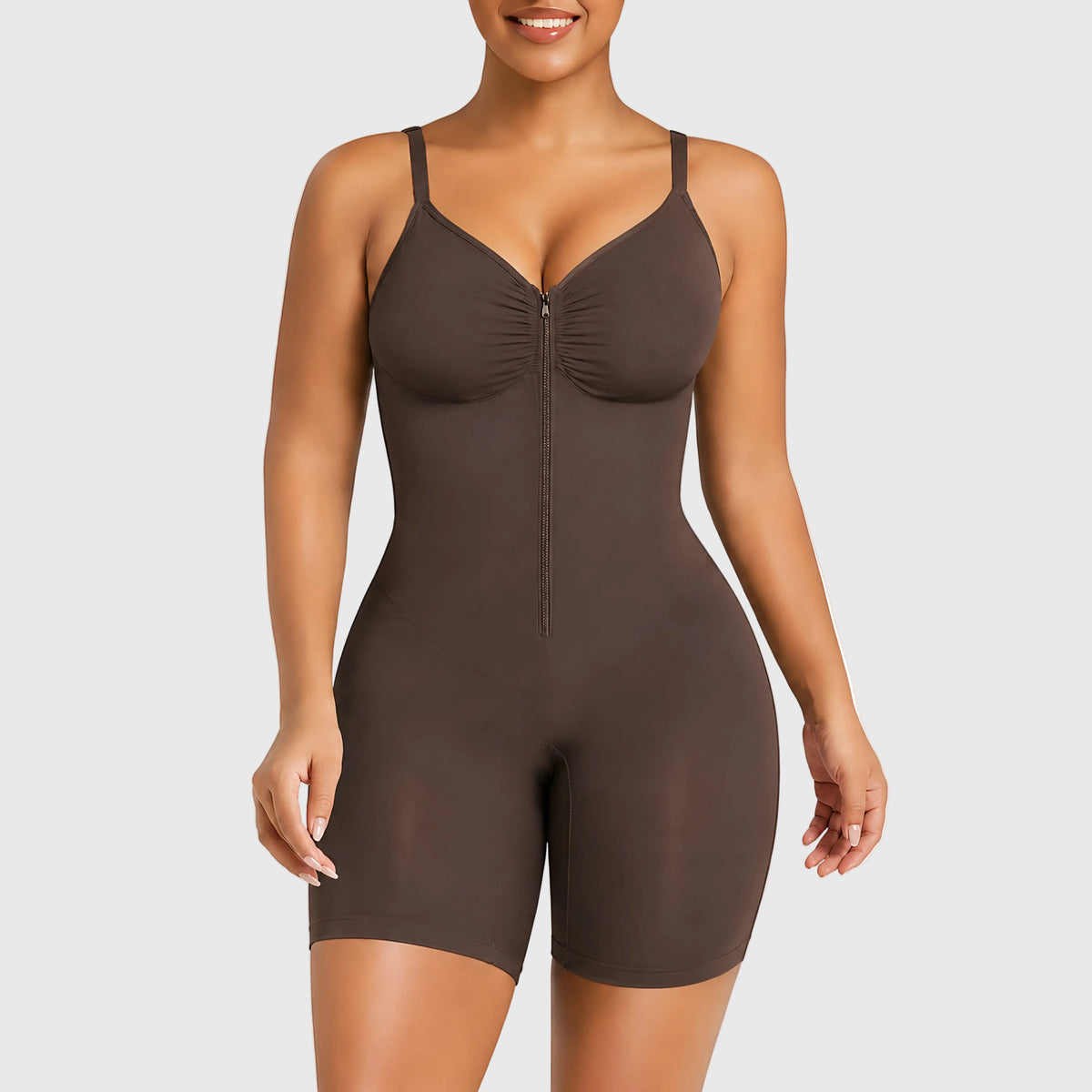 Brown shapewear bodysuit worn by a model on a white background