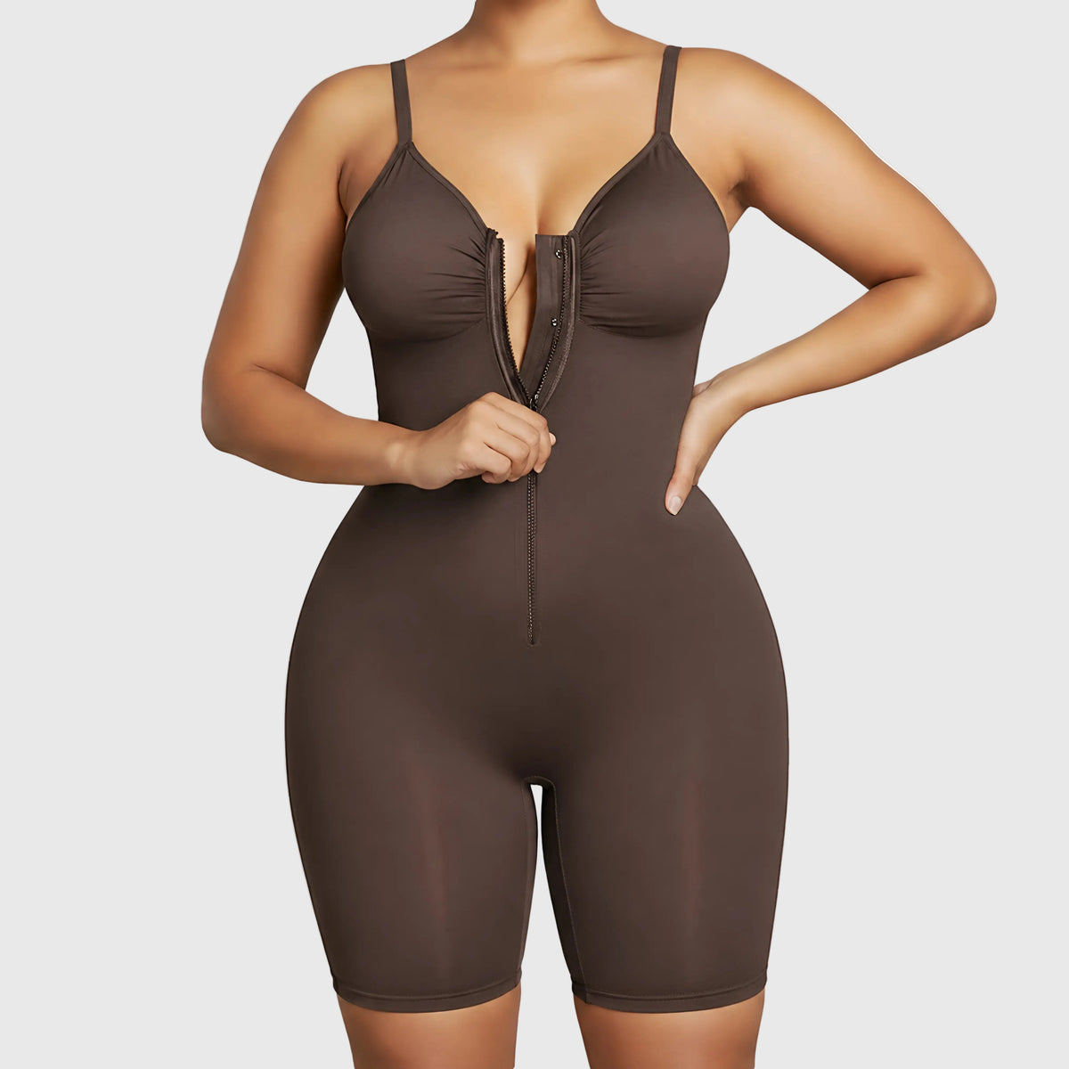 Brown bodysuit worn by a model on a white background