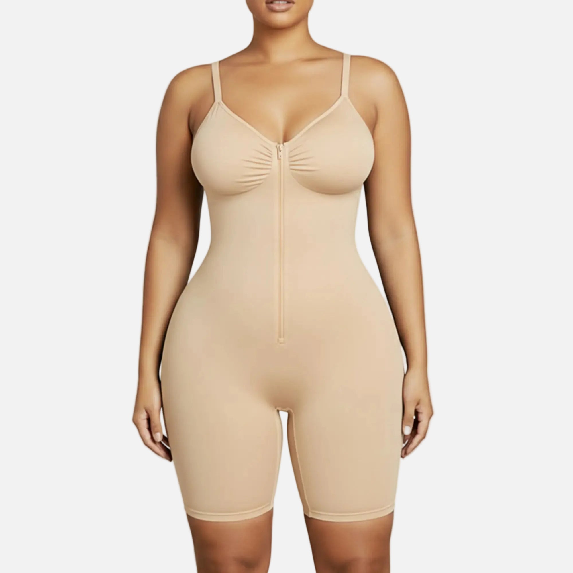 Beige shapewear bodysuit worn by a model on a white background
